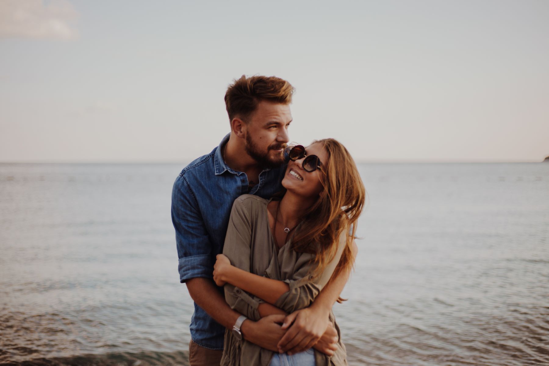 Couple on Beach in front of water