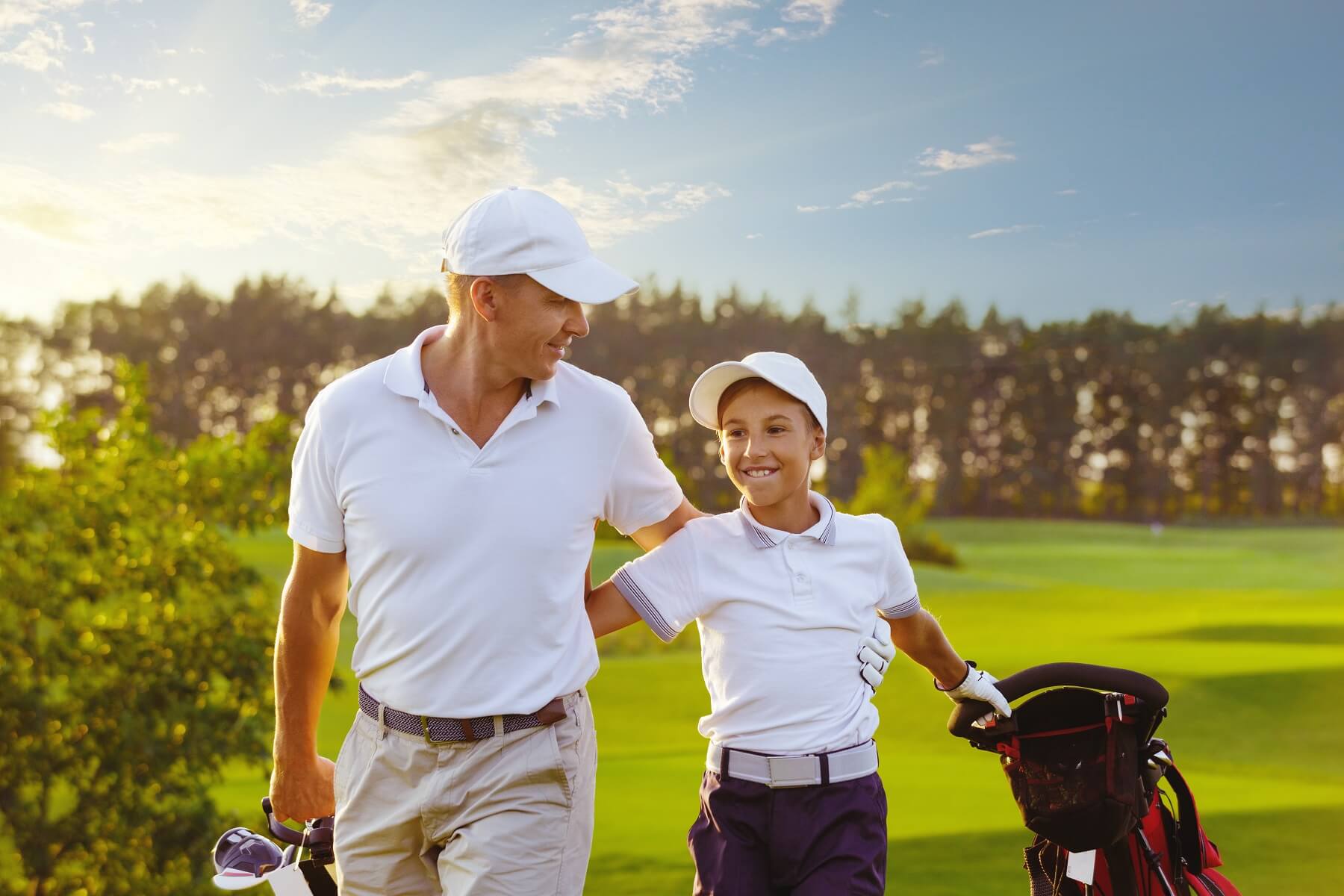 dad and son playing golf