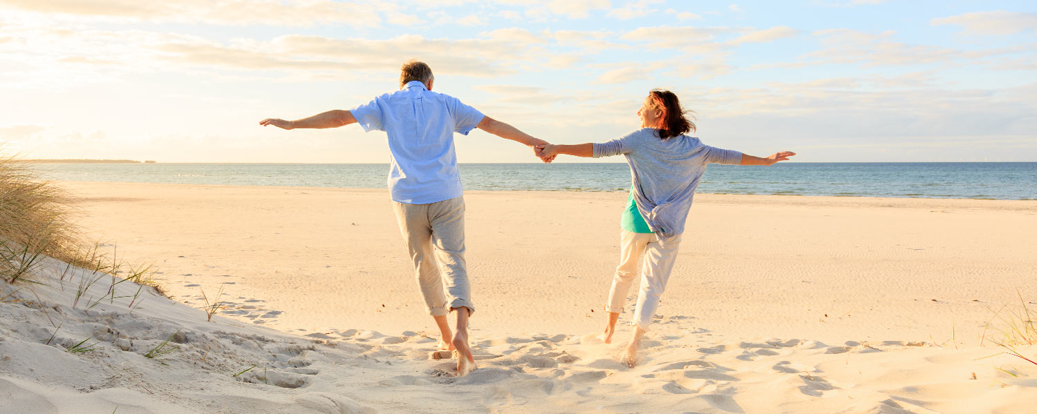 couple on the beach holding hands