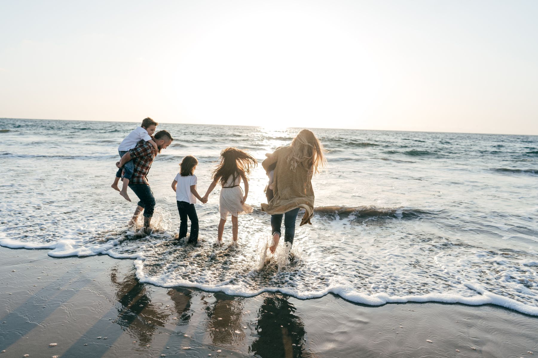 family on beach in january