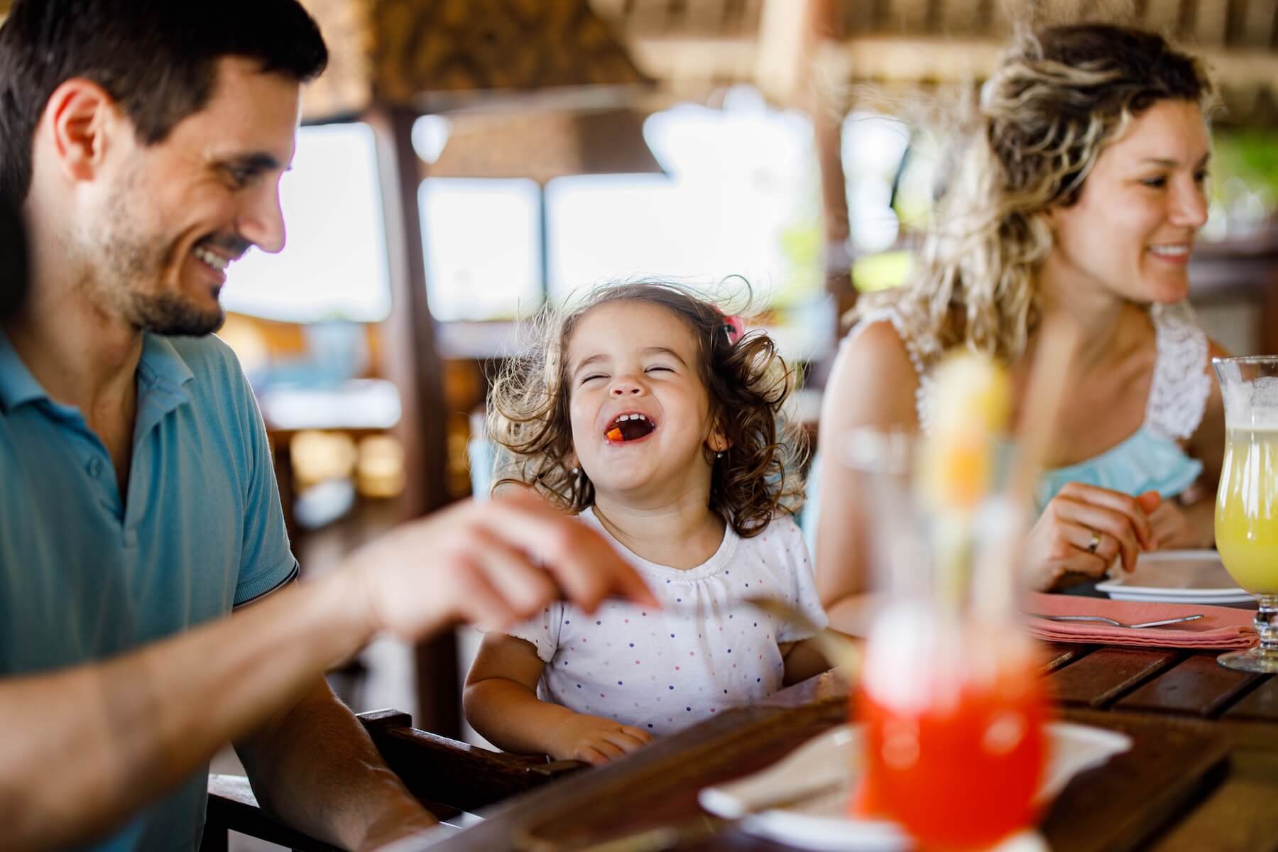 family enjoying dining out at a restaurant near Barefoot Landing